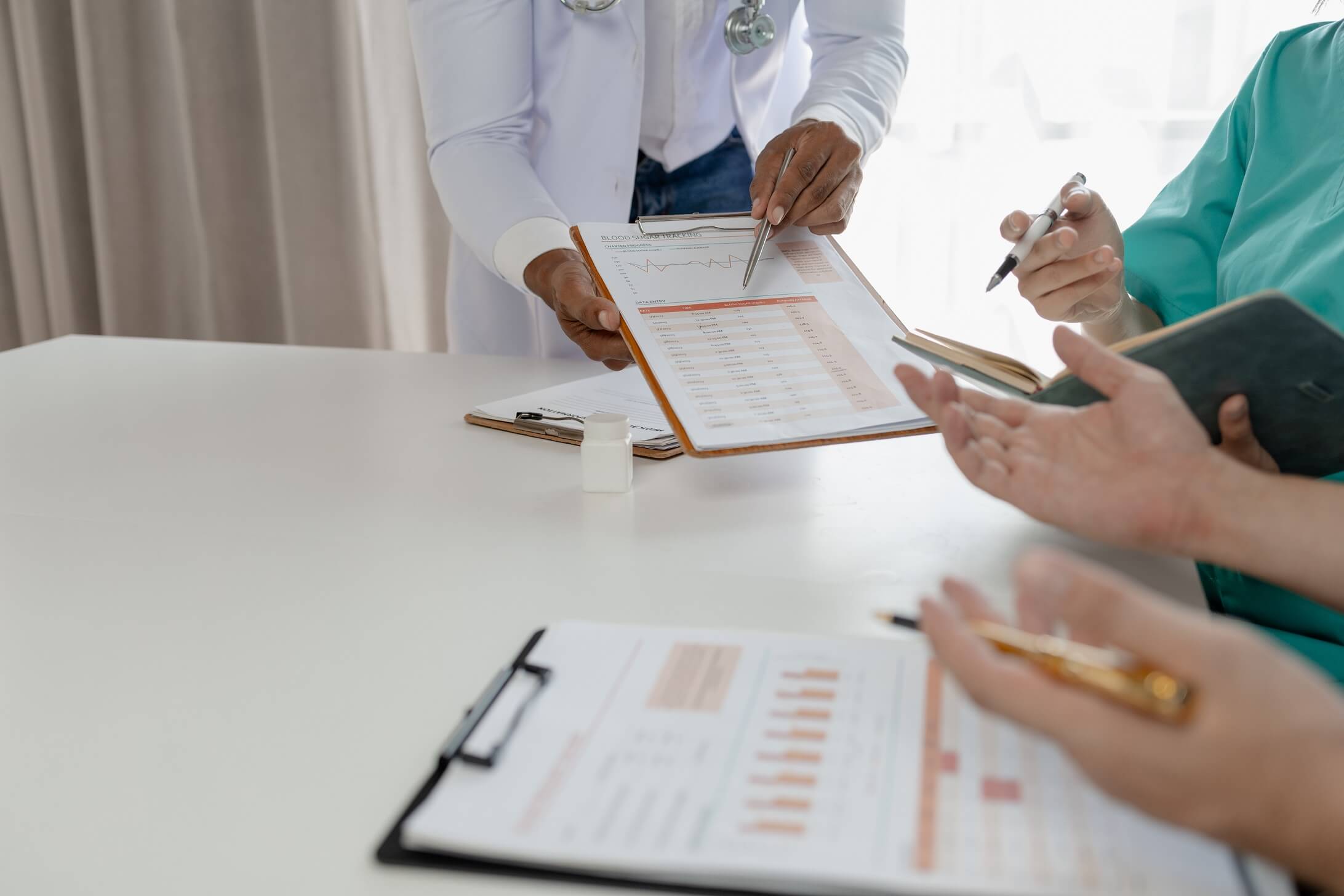 A group of healthcare professionals discussing test results