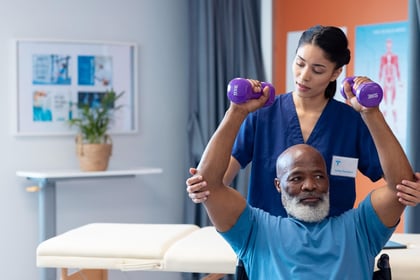 Physiotherapist supporting patient in treatment