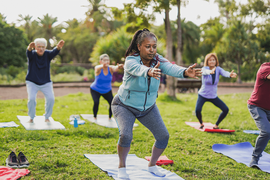 senior people exercising in a park