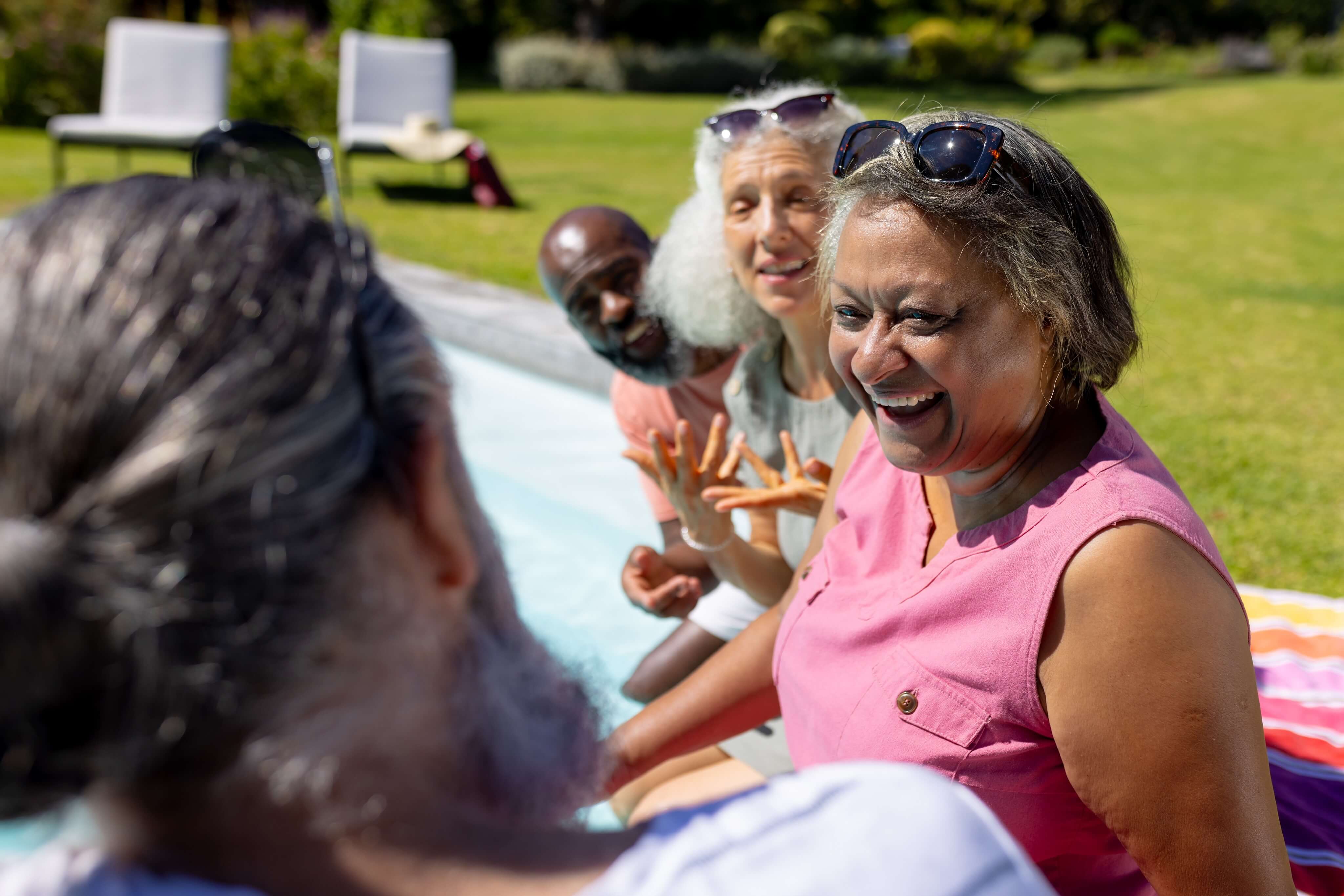 A group of older friends socialising outdoors