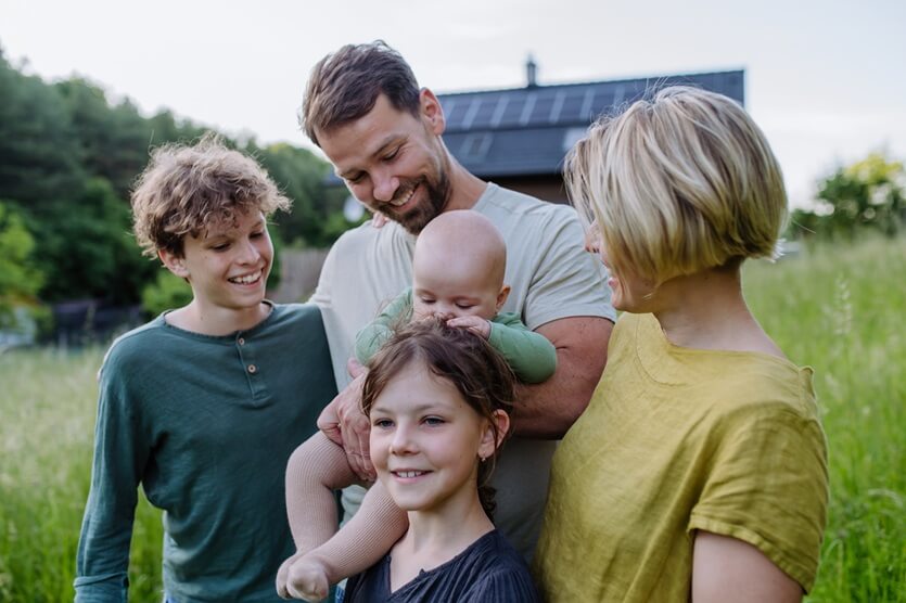 happy family near their house outdoors