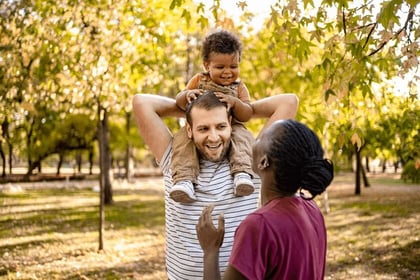 family enjoying time outdoors in the autumn sun