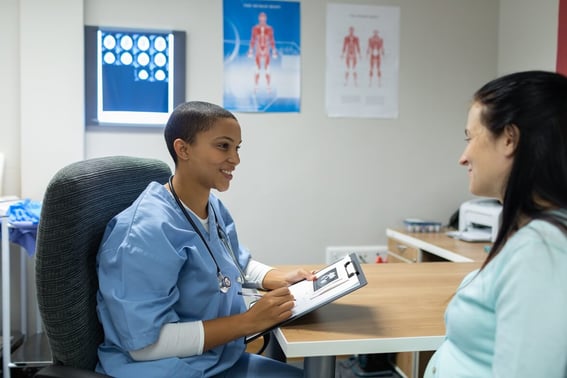 female doctor giving patient an assessment