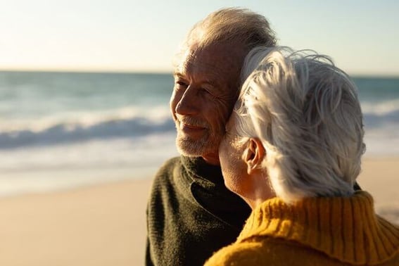 older couple relaxing at the beach