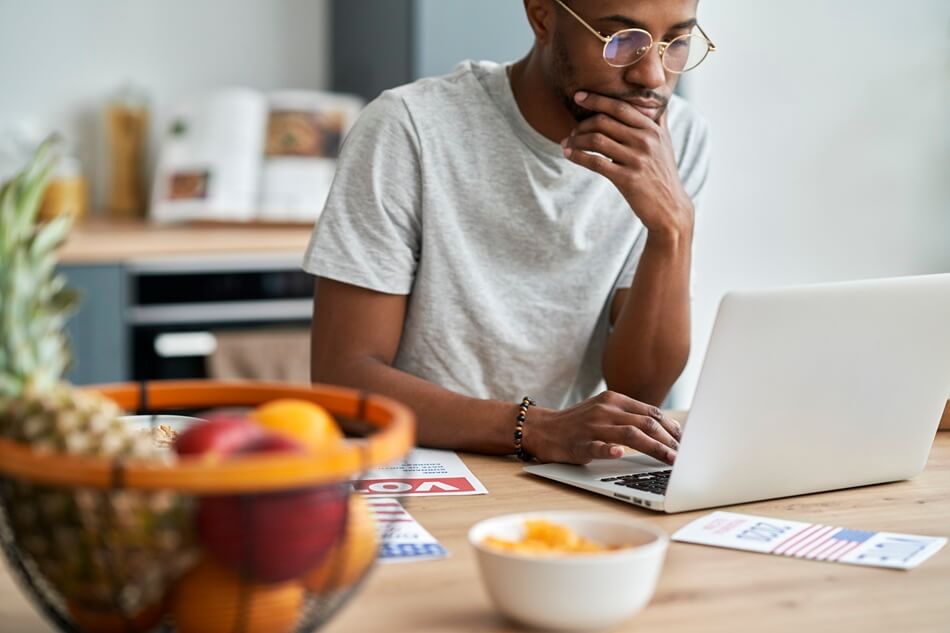 man looking on the computer at home
