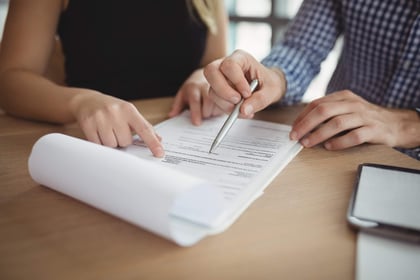 People reviewing a policy document