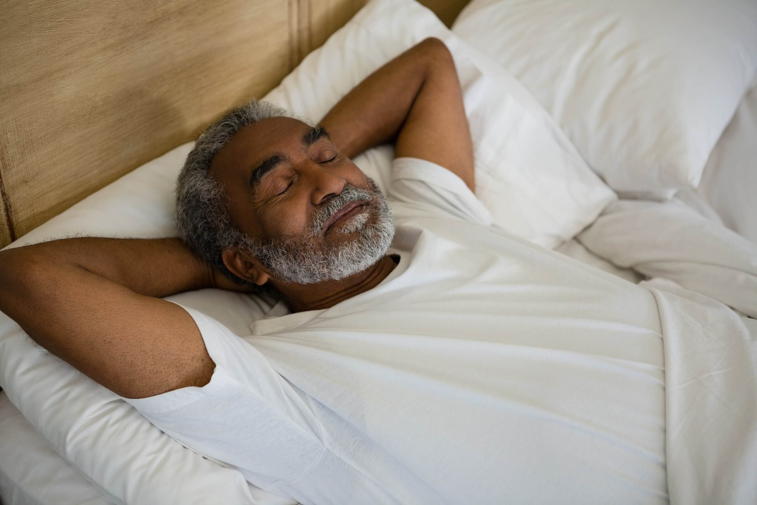 senior-man-sleeping-on-bed-in-the-bedroom-2023-11-27-05-25-55-utc (1)