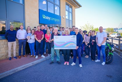 Usay Compare present cheque to Southmead Hospital Charity
