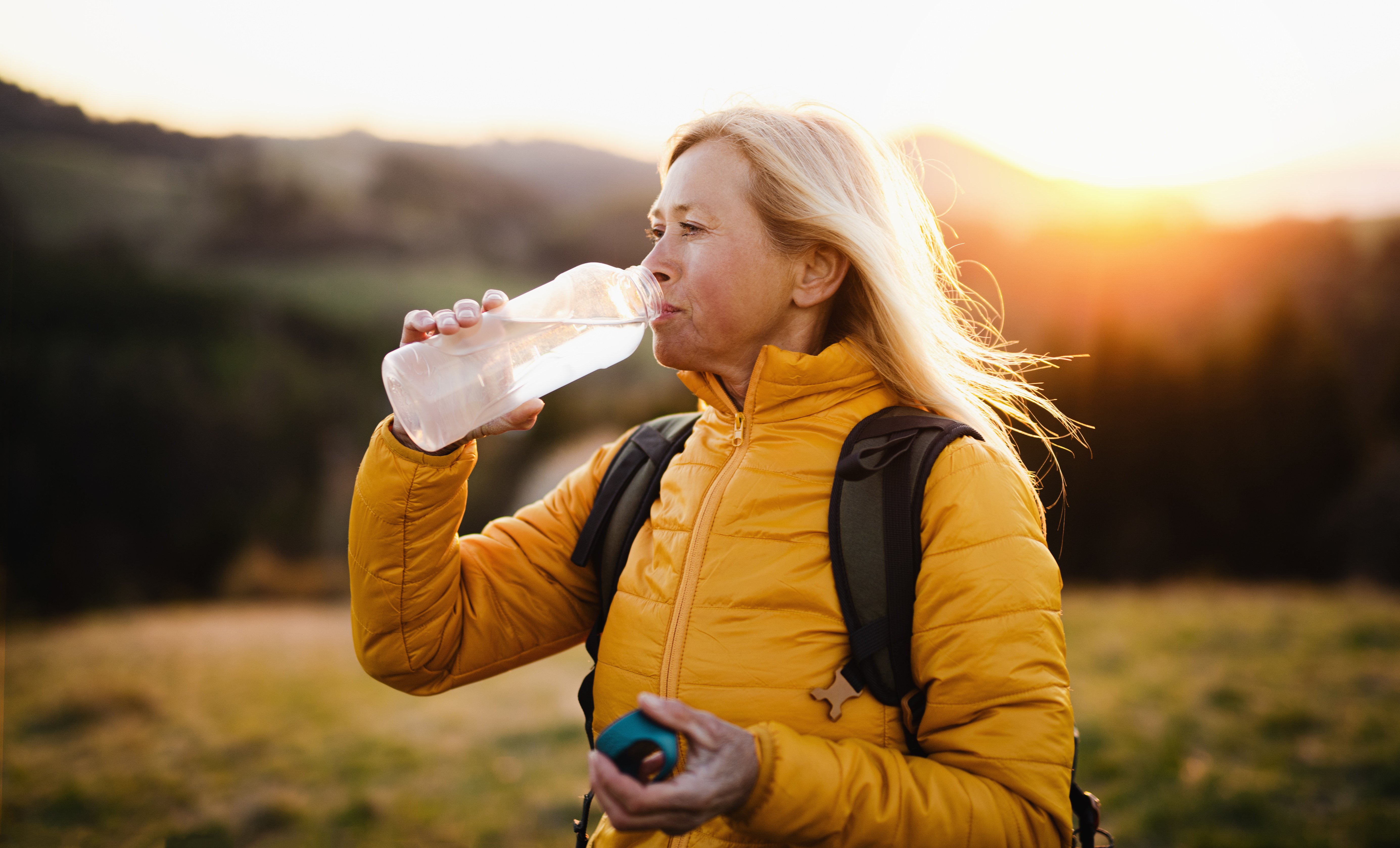 attractive-senior-woman-walking-outdoors-in-nature-2022-02-02-03-59-42-utc