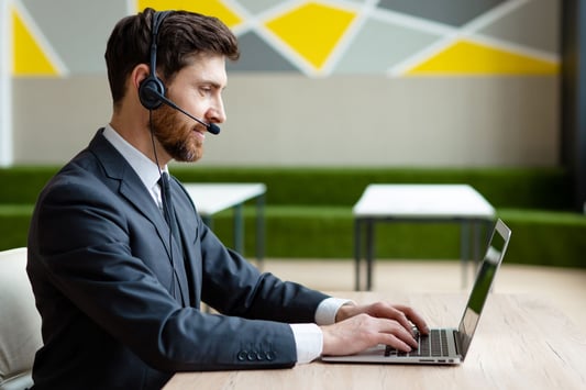 businessman-sitting-at-computer-desk-in-the-office-private-health-insurance
