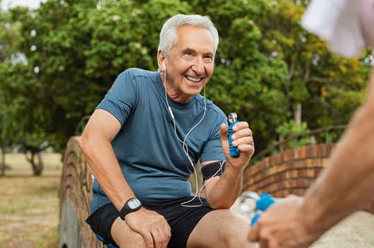 old-man-exercising-using-hand-gripper-private-medical-insurance