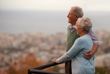 Older couple looking out onto water
