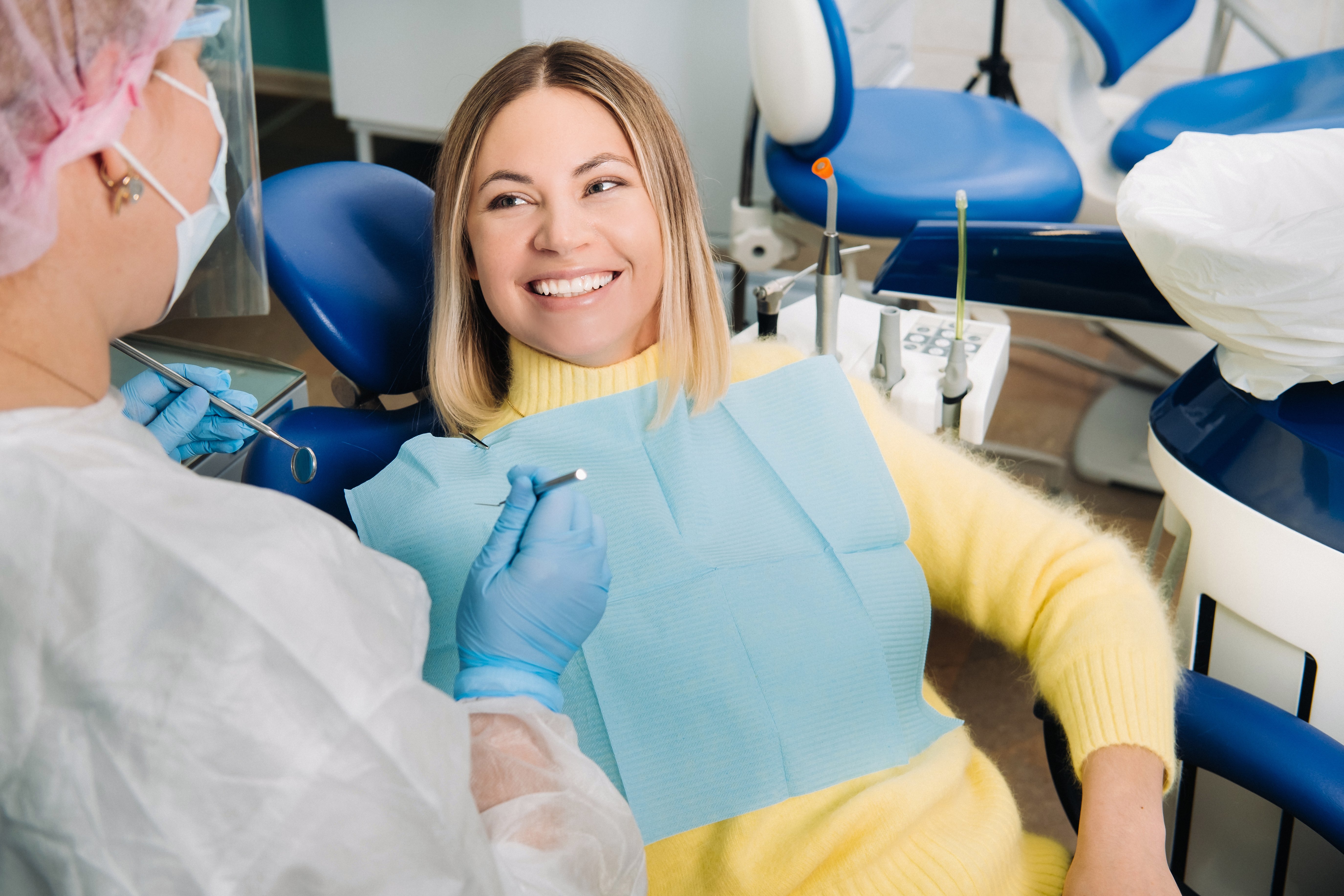 the-girl-smiles-at-the-dentist-and-looks-at-her-2021-12-13-19-35-06-utc