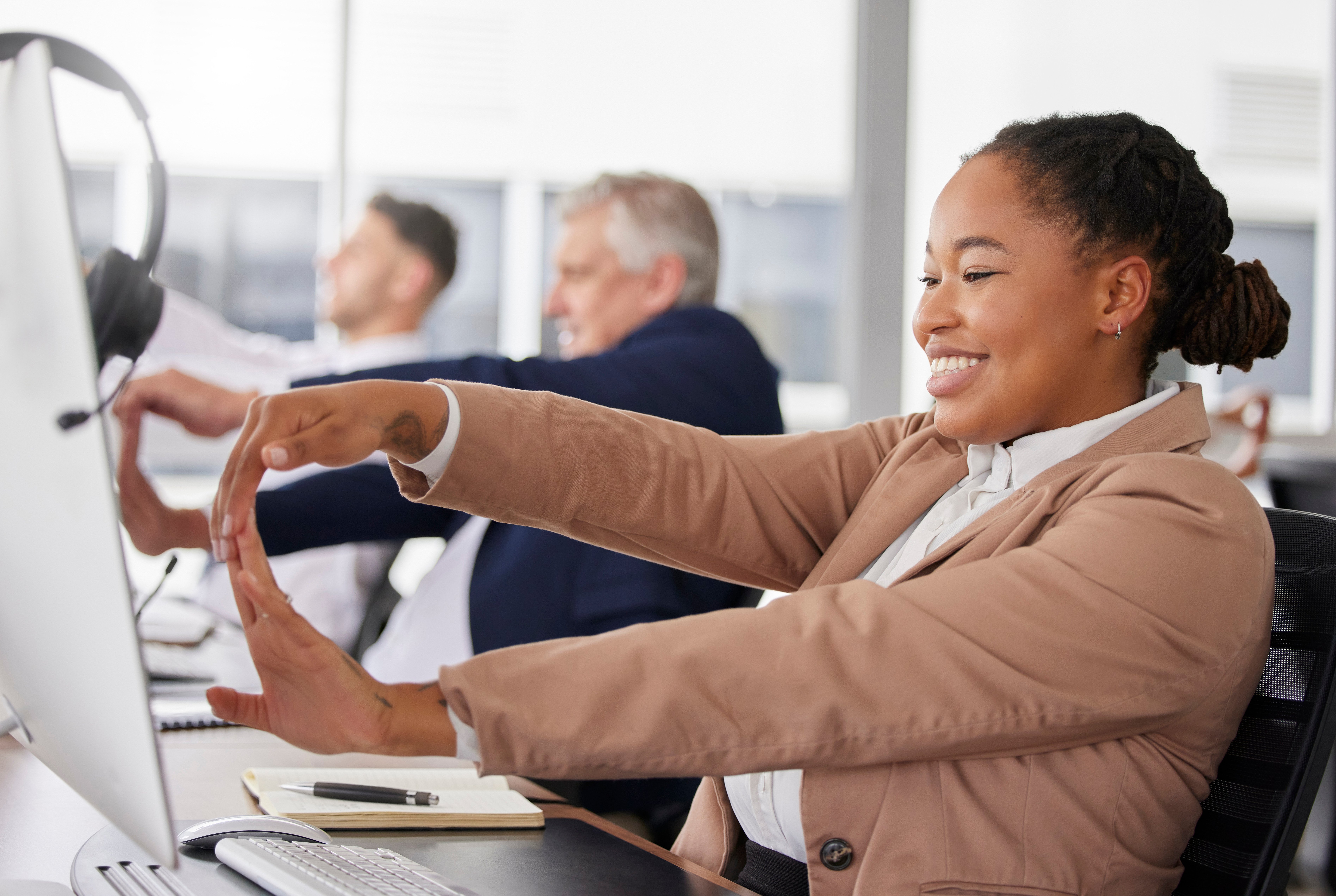 woman-call-center-and-stretching-hand-at-desk-for-2023-04-11-22-38-48-utc